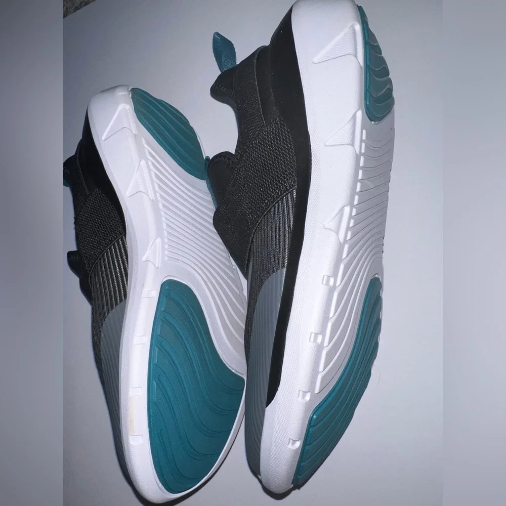Kids Black Slip-On Athletic Shoes with Teal Accents